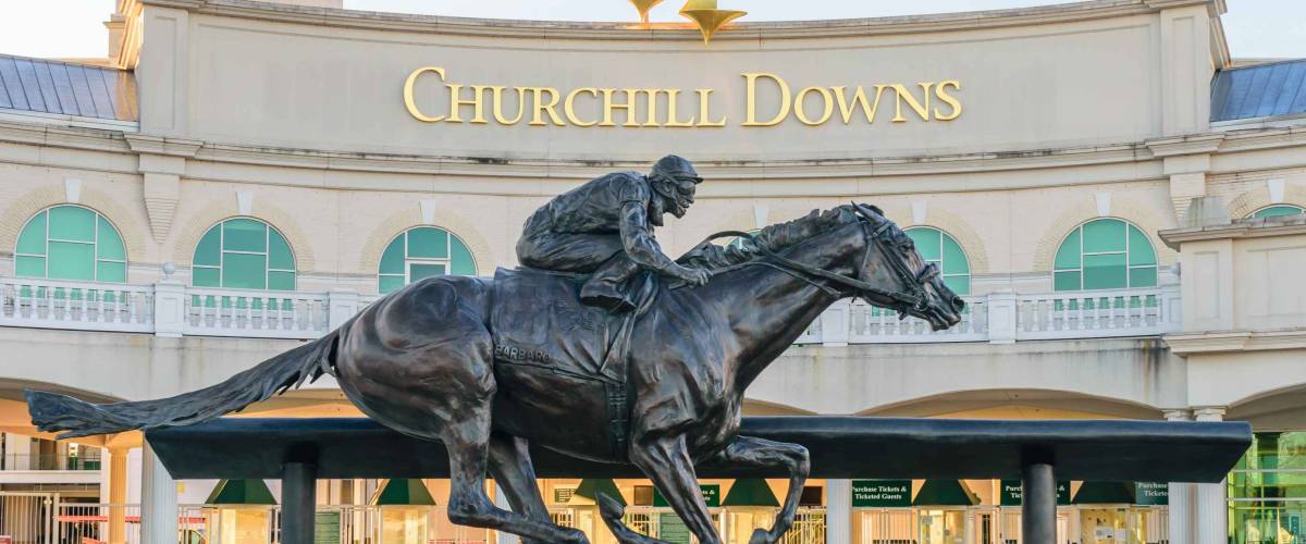 LOUISVILLE, KENTUCKY, USA - APRIL 3 2016: Entrance to Churchill Downs featuring a statue of 2006 Kentucky Derby Champion Barbaro.