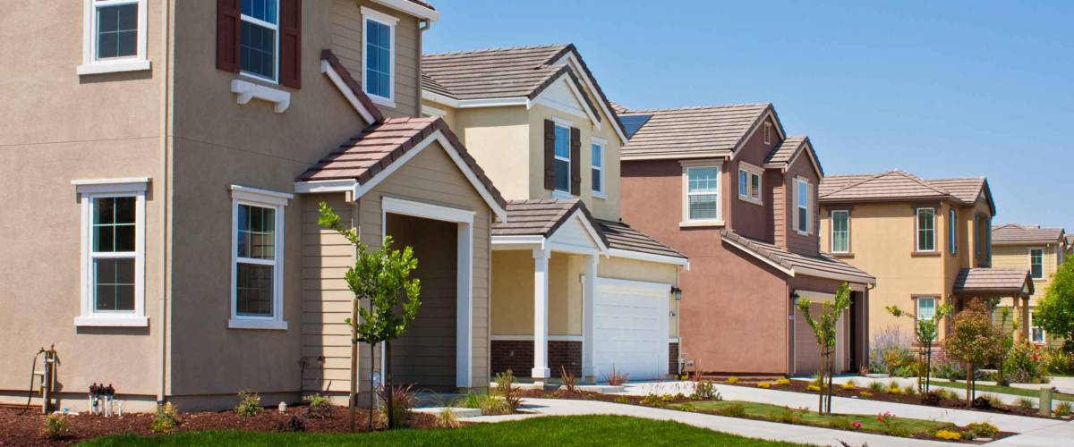 A row of new tract houses in a residential subdivision near San Jose, California.