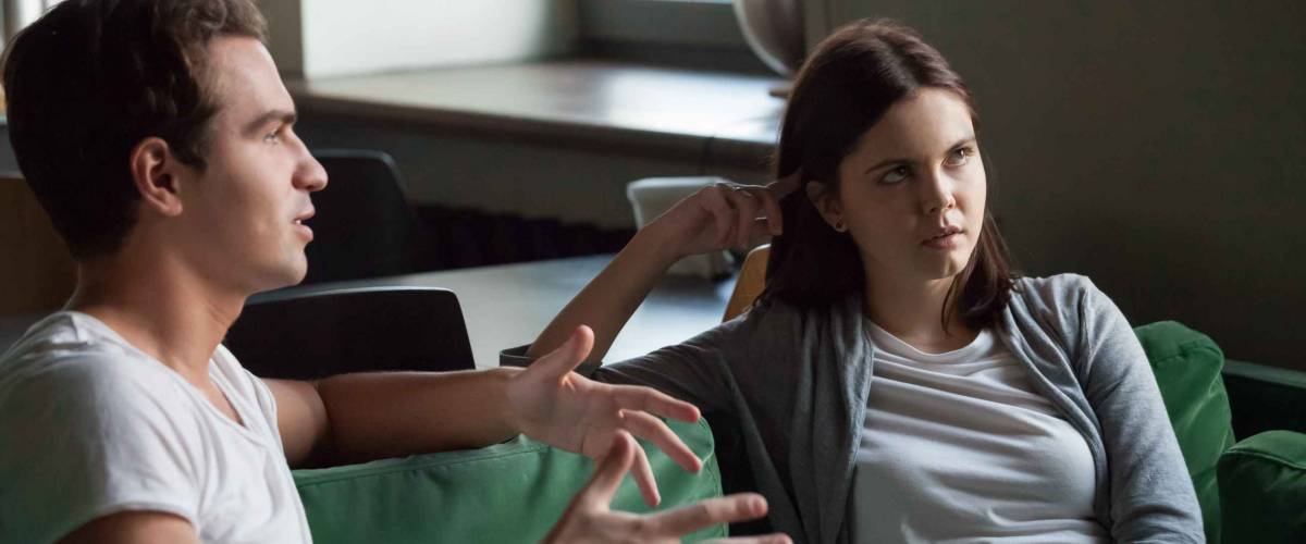 Annoyed girl tired of listening to boyfriend's excuses