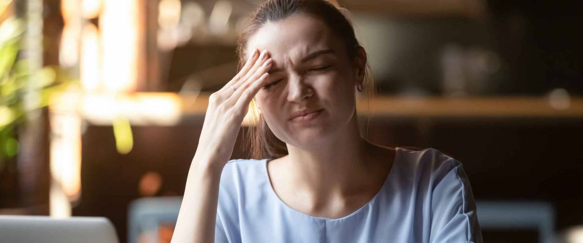 Businesswoman or student girl sitting at table near pc feels stressed and forgot about closing costs