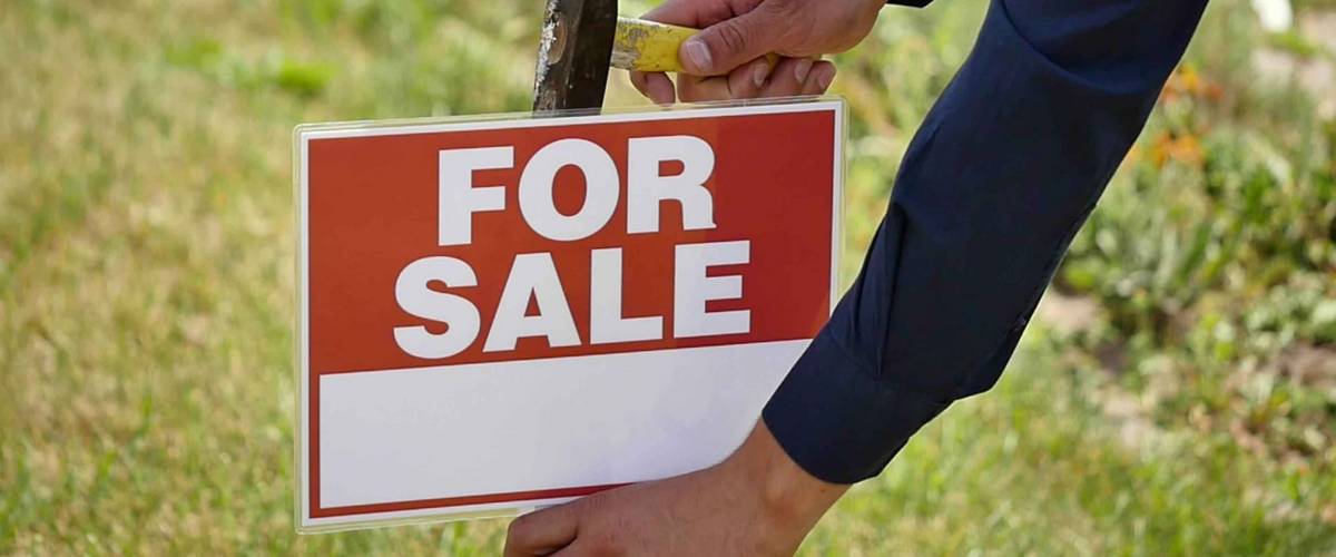 male hands hammer sign for sale