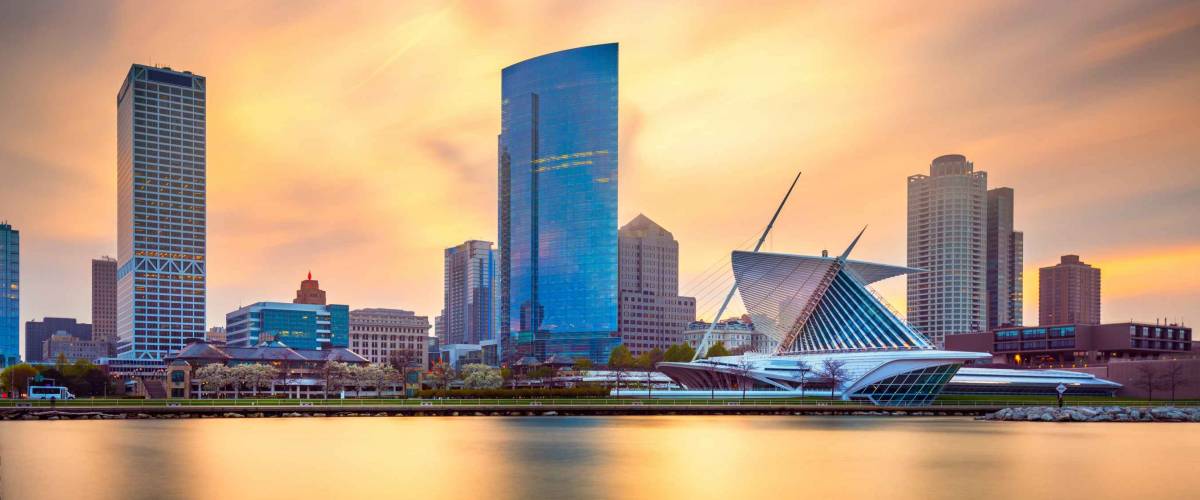 Milwaukee, Wisconsin, USA downtown city skyline on Lake Michigan at twilight.