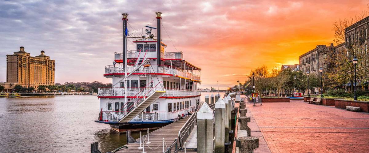 Savannah, Georgia, USA riverfront promenade at sunrise.