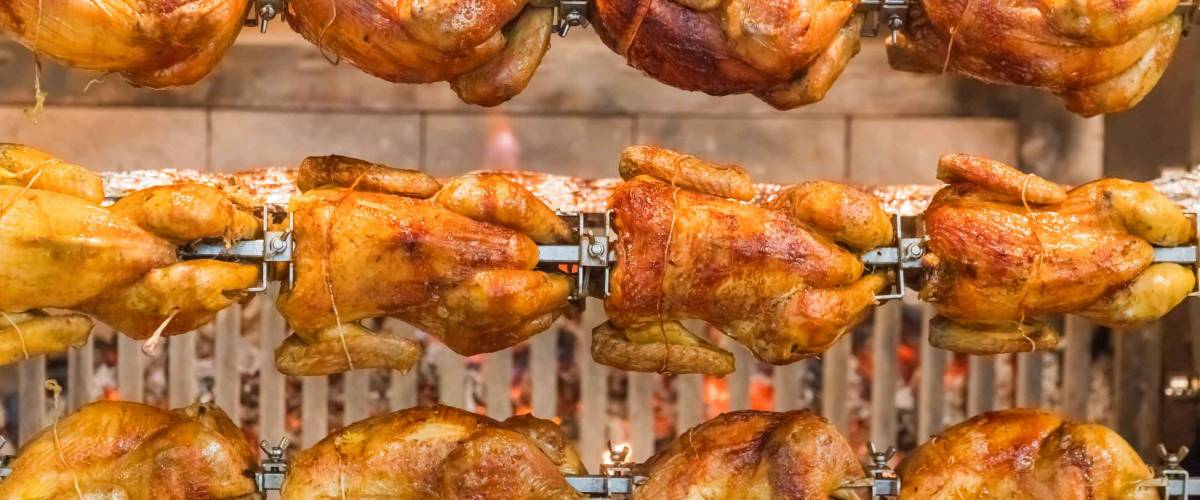 Grilled chickens on a spit, background