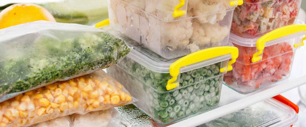 Frozen food in the refrigerator. Vegetables on the freezer shelves. Stocks of meal for the winter.