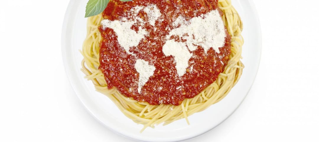 Freshly cooked dish of tasty pasta with tomato sauce and parmesan cheese in the shape of the world .(series)