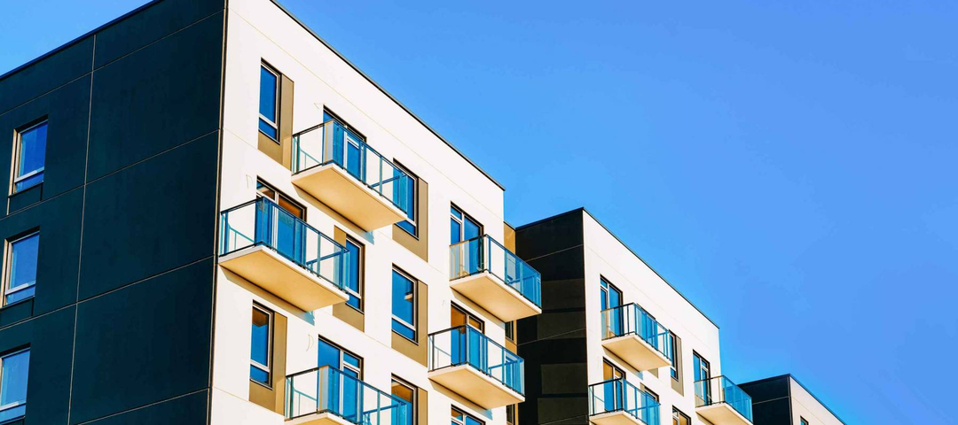 Fragment of Modern residential apartment with flat buildings exterior.