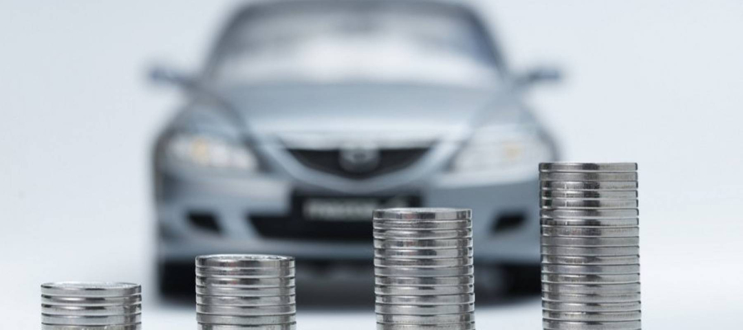 Vehicle parked behind stacks of coins