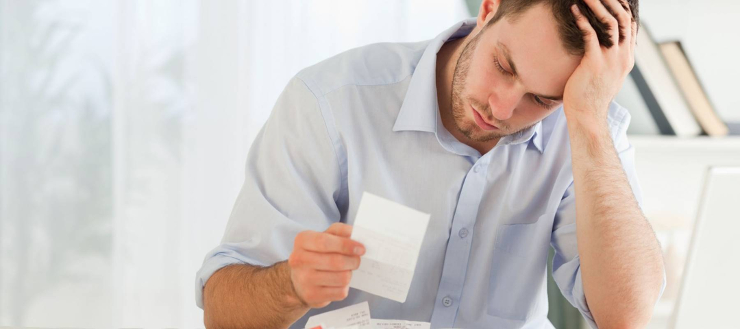 Young businessman worried about bills