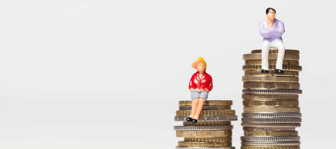 Gender pay equality concept. man and woman on a stack of coins.