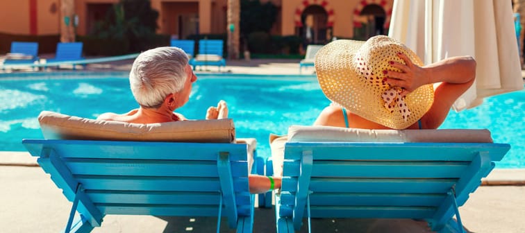 Retired couple by the pool