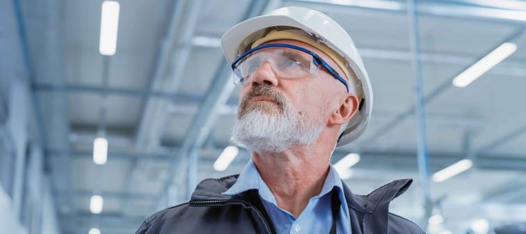 Portrait of a Middle Aged, Successful Male Engineer in White Hard Hat