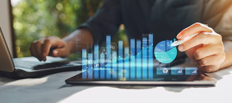 Businessman work with ai for economy analysis financial result by digital augmented reality graph.