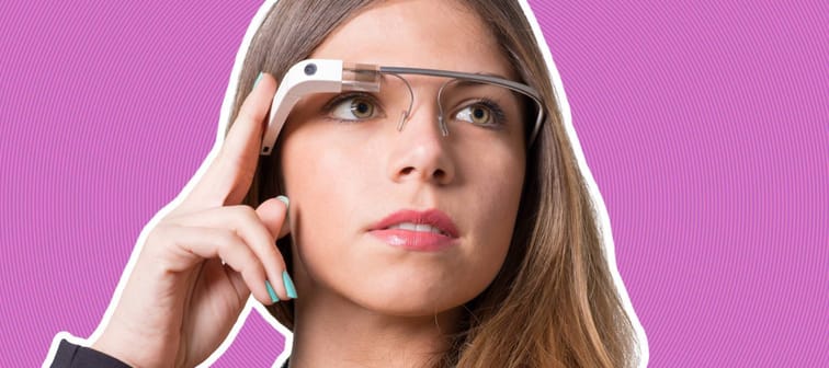 a blonde woman looking off into the distance, wearing Google Glass