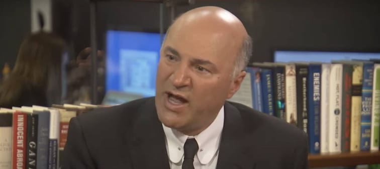 Kevin O'Leary seen in the Huffington Post office, speaking with purpose and intent.