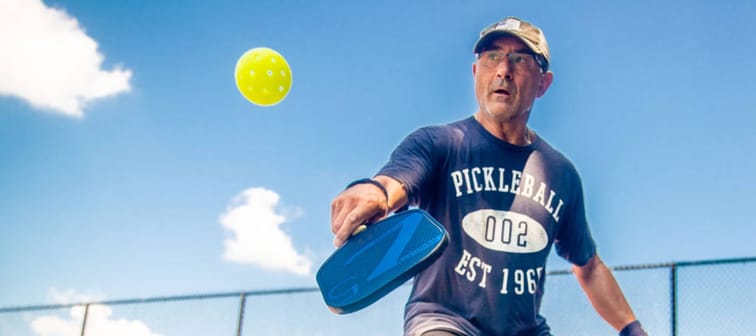 an Regini, 64, of Port Jefferson Station, plays pickleball, a paddle sport on a court at Charles P. Toner Park in Nesconset, New York.