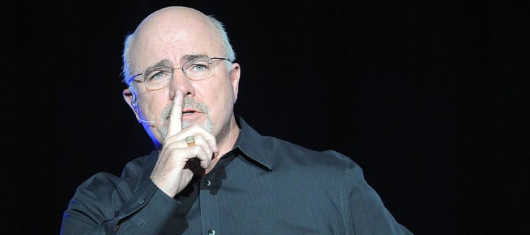 Personal finance guru Dave Ramsey speaks to a crowd of thousands at his event