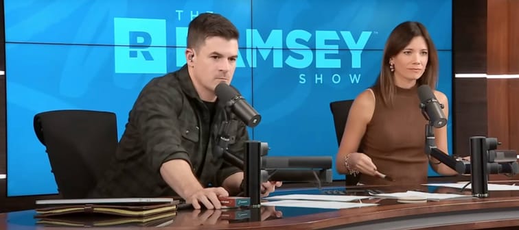 The Ramsey Show co-hosts John Delony and Rachel Cruze speak to a caller during show.