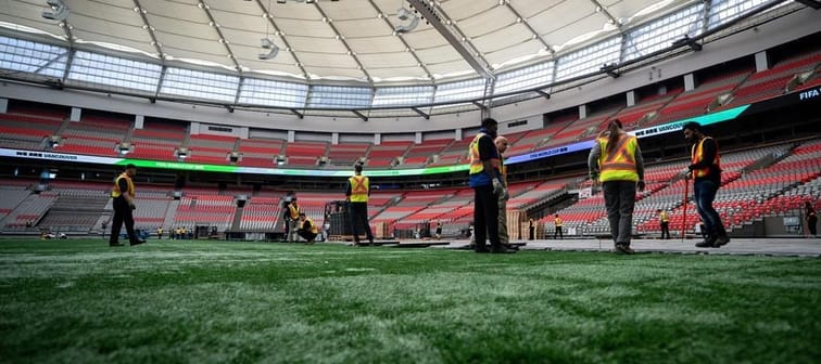 Crews work on the turf at B.C. Place during a FIFA World Cup 2026 update in Vancouver, Tuesday, April 30, 2024. 