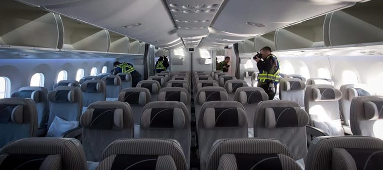 An airplane travelling from Paris to Seattle was forced to make an emergency landing at Iqaluit&rsquo;s airport. Members of the media take photos and record video in the forward economy cabin