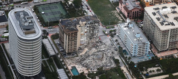 In this aerial view, search and rescue personnel work after the partial collapse of the 12-story Champlain Towers South condo building on June 24, 2021 in Surfside, Florida.