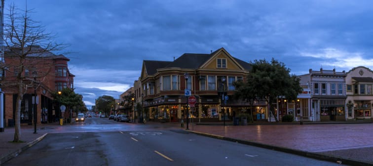 Downtown Eureka, California during early morning hours. Old Victorian buildings line the street.
