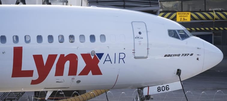 A Lynx Air Boeing 737 jet sits at a gate at the international airport in Calgary on Friday, February 23, 2024. Before its shutdown this week, Lynx Air was planning to pay off at least a big c