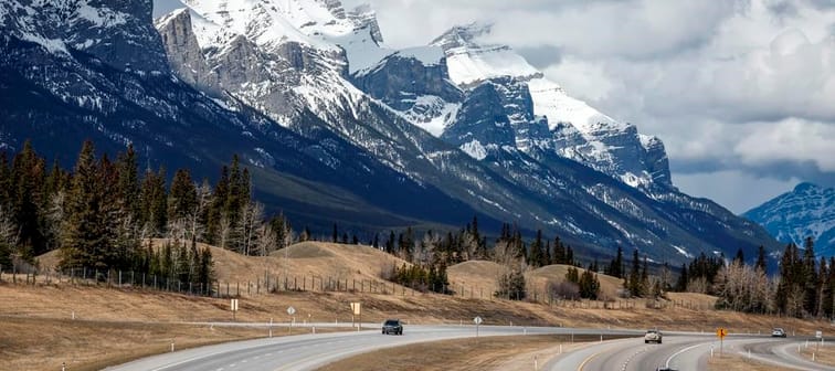 Traffic travels along the Trans Canada Highway past Mount Rundle of the Rocky Mountains near Canmore, Alta., Monday, April 24, 2023. Documents released under Alberta Freedom of Information la