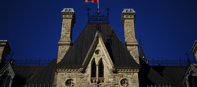 A Canada flag flies on top of the West Block on Parliament Hill in Ottawa on Tuesday, April 16, 2024. 