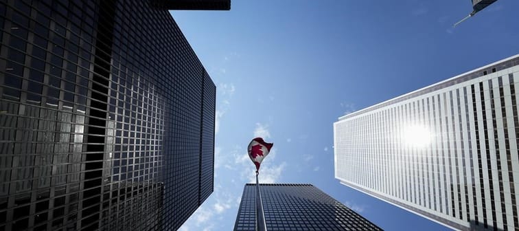 A Canadian flag flies in the Bay Street financial district in Toronto on Friday, August 5, 2022. 