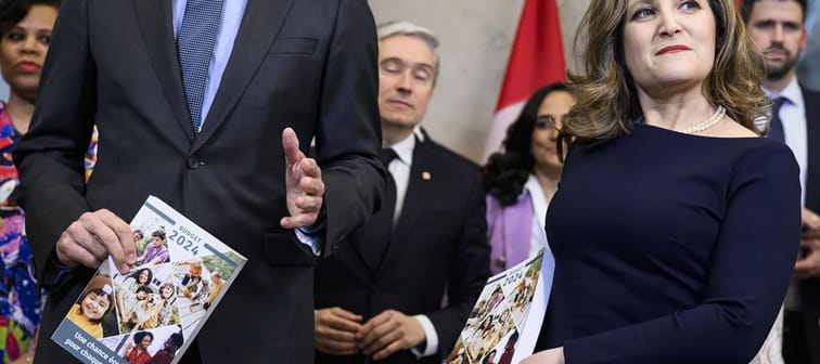 Prime Minister Justin Trudeau, left, and Deputy Prime Minister and Minister of Finance Chrystia Freeland hold copies of the federal budget as they pose for a photo before its tabling, on Parl