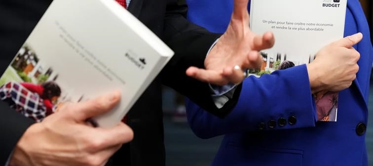Copies of the 2022 federal budget documents are seen in the hands of Finance Minister and Deputy Prime Minister Chrystia Freeland and Prime Minister Justin Trudeau as they speak with members 