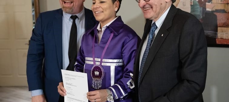 Mohawk Grand Chief Kahsennenhawe Sky-Deer, is flanked by Hydro-Qu&eacute;bec chief executive Michael Sabia, right, and Quebec Minister of First Nations Relations Ian Lafreni&egrave;re, left, 