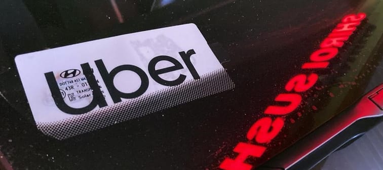 An Uber sign is displayed inside a car in Glenview, Ill., Saturday, Dec. 17, 2022. Uber Technologies Inc. says it has brought its ridesharing platform to Newfoundland and Labrador. 
