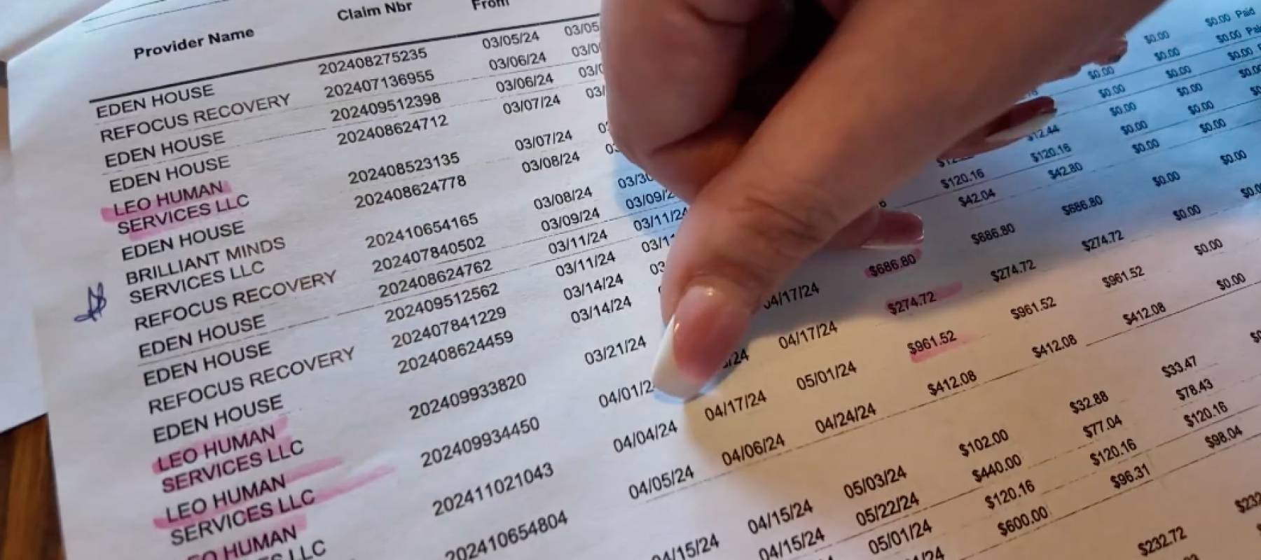 Woman's thumb on sheet of paper