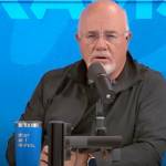 Dave Ramsey speaking in front of.a mic.