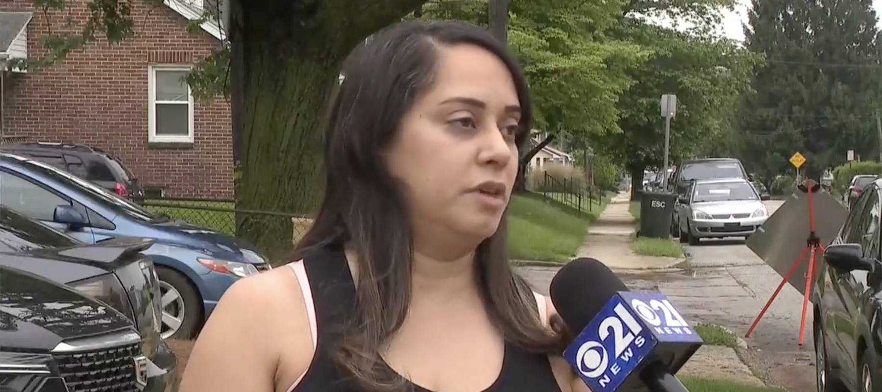 Renter Annette Martinez being interviewed on street about stolen money.