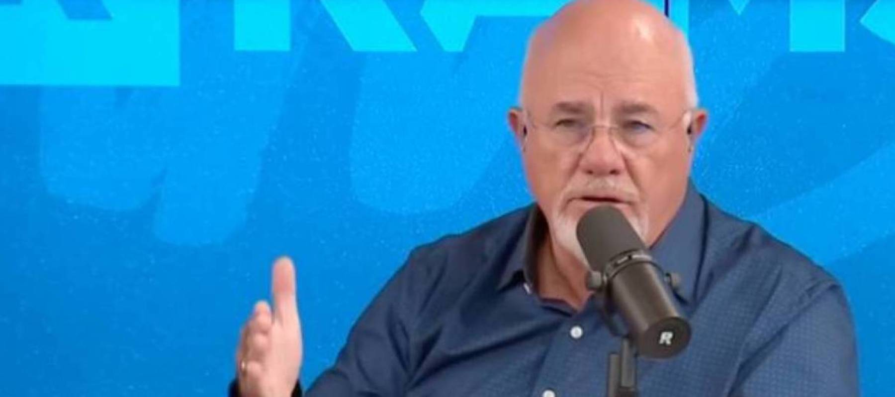 Dave Ramsey speaking into a mic.