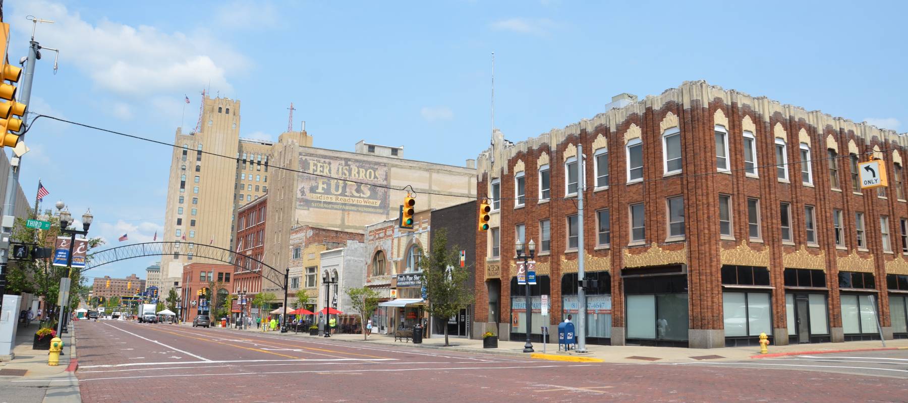 Exterior view of downtown area of Flint Michigan with brick buildings.