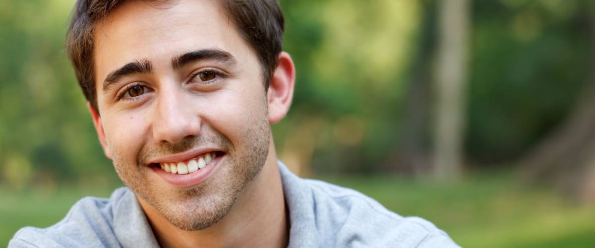 Smiling young man outdoors
