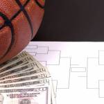 A March Madness tournament bracket with a basketball and fanned money