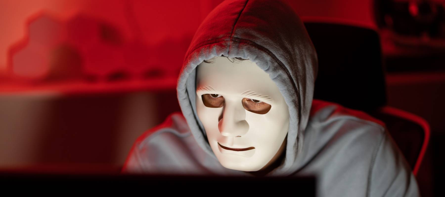 hacker sits at computer