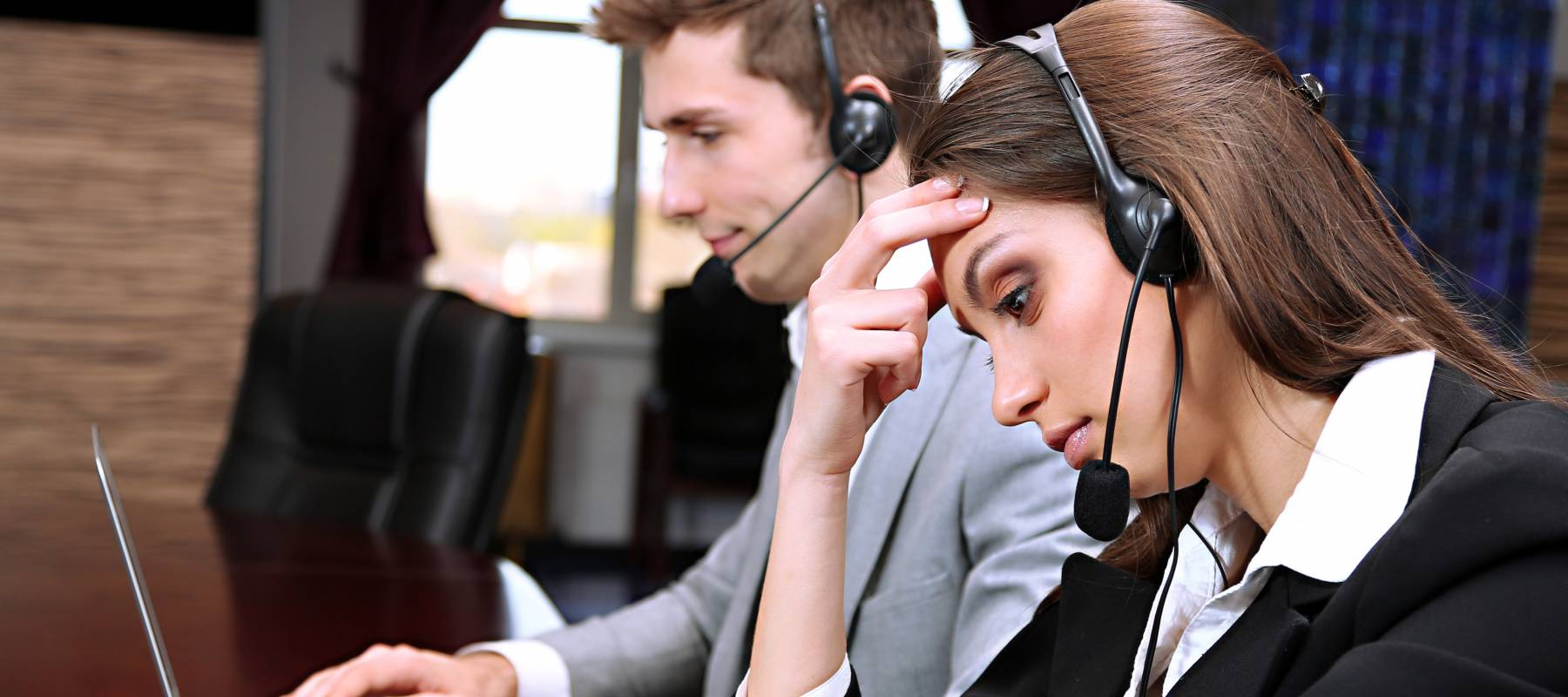 Portrait of a cheerful man in the vegetable department of the supermarket. A funny man holds oranges around the eyes. Purchase of fruit in a supermarket.