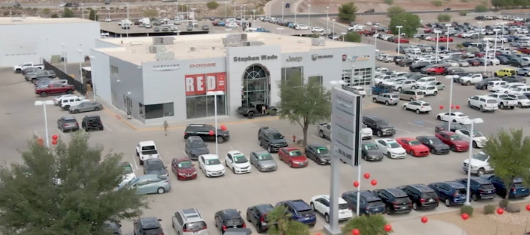 Overhead shot of a car dealership.