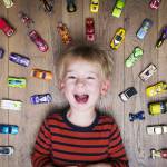 Boy with toy cars