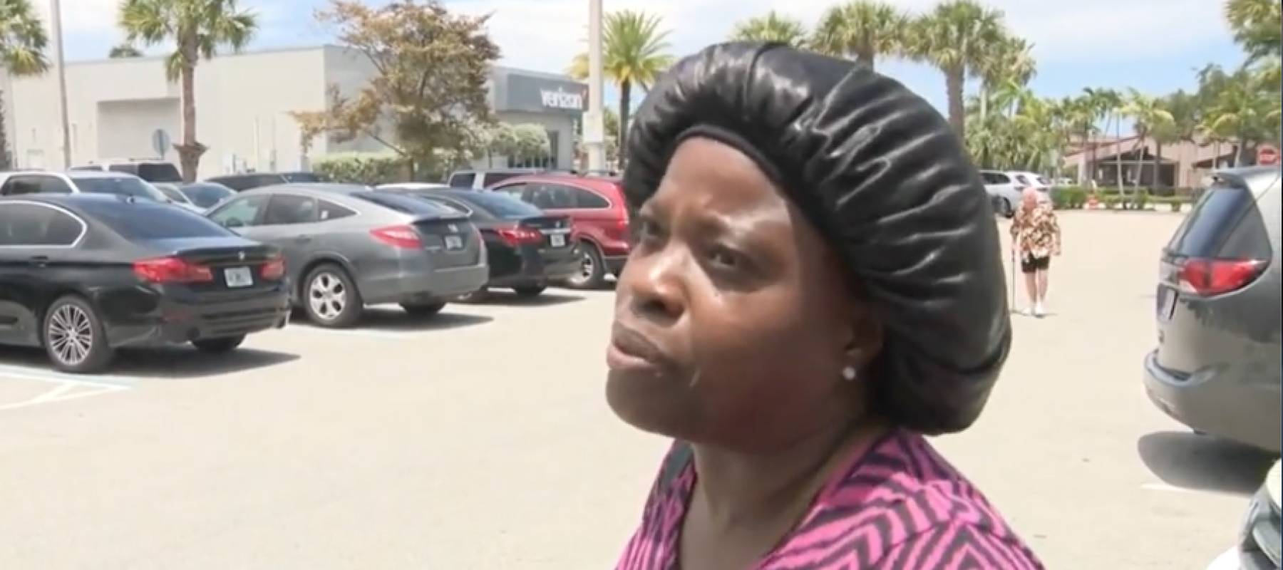 Mary Charlsmith interviewed in parking lot about flood aid cut.