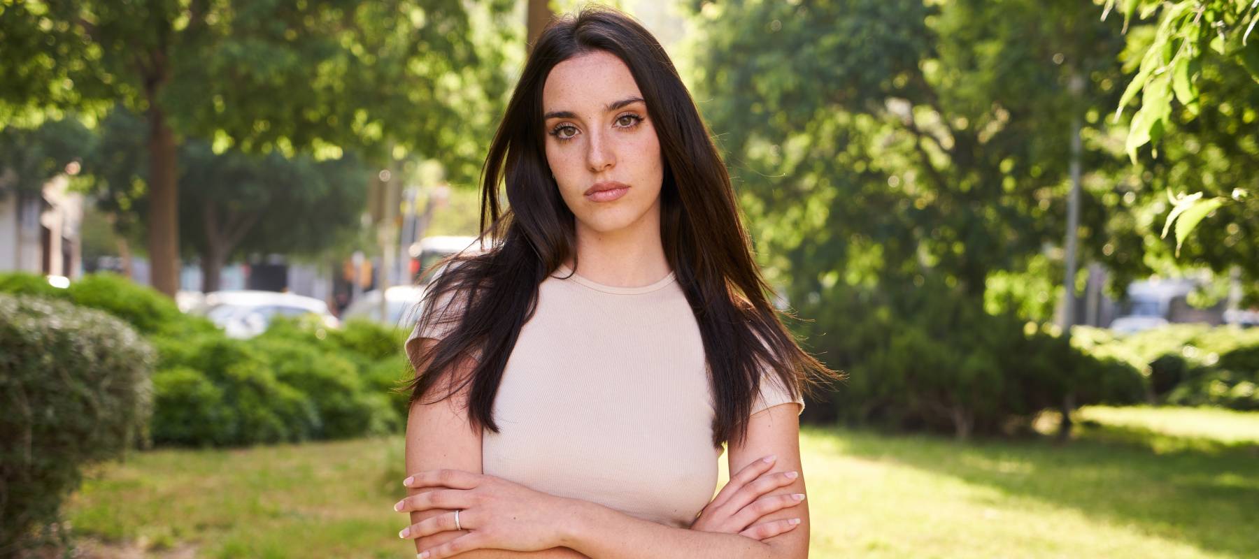 A young women with a serious look on her face.