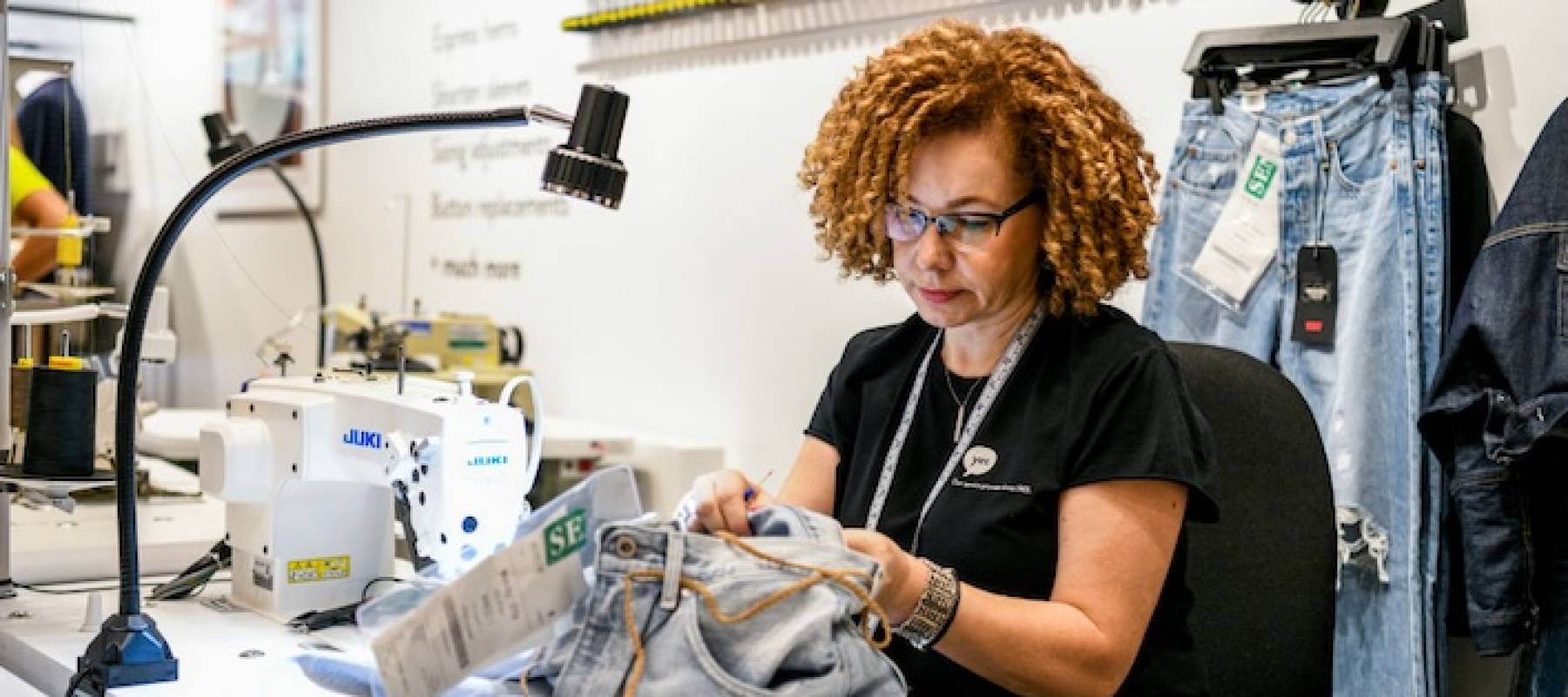 Woman tailoring jeans