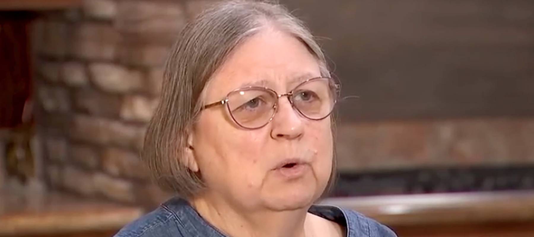 Woman speaking on camera.