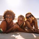 Young happy people on a yacht.